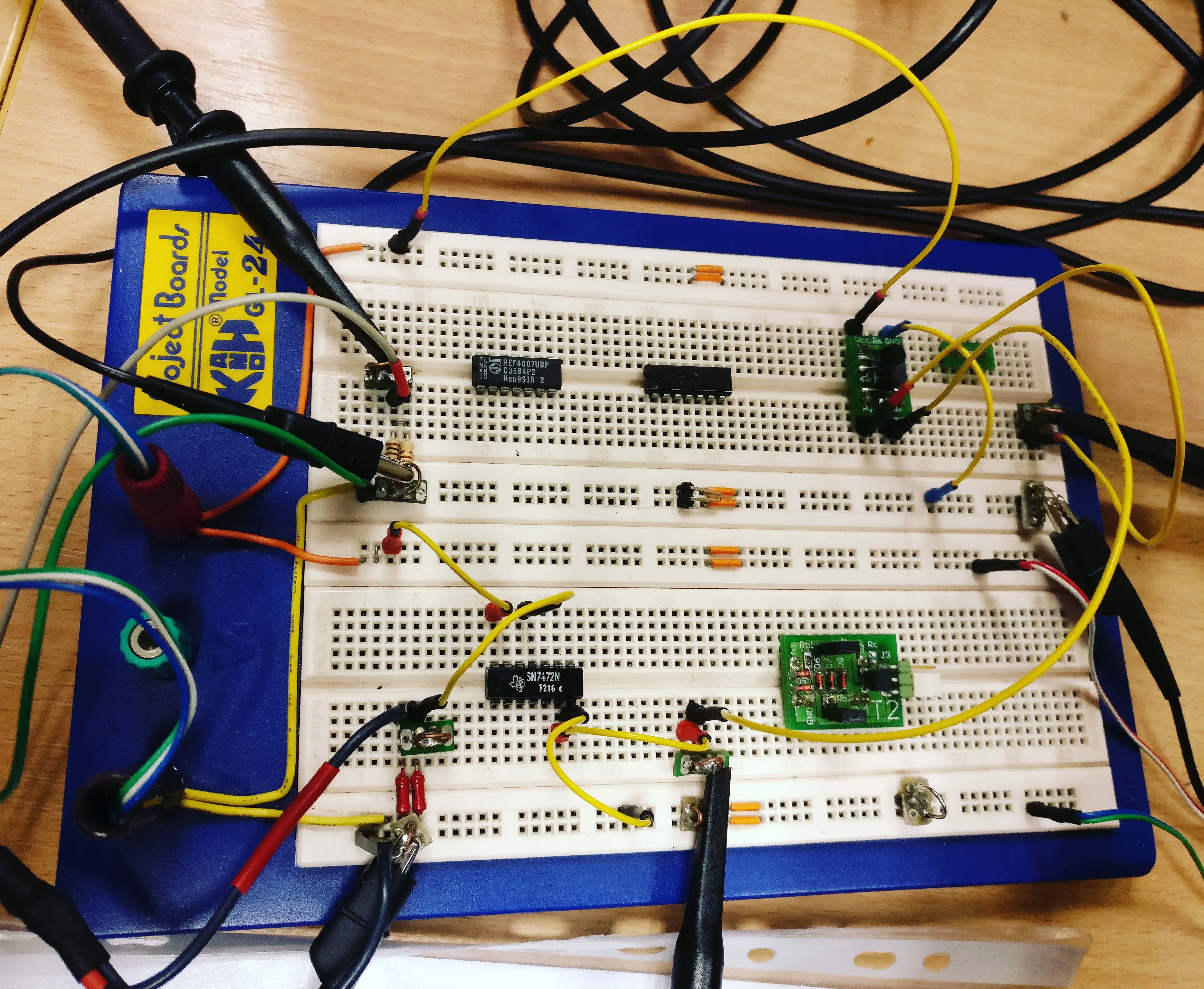 Breadboard Close-up - Two 74LS27 ICs with visible decoupling capacitors and measurement connections