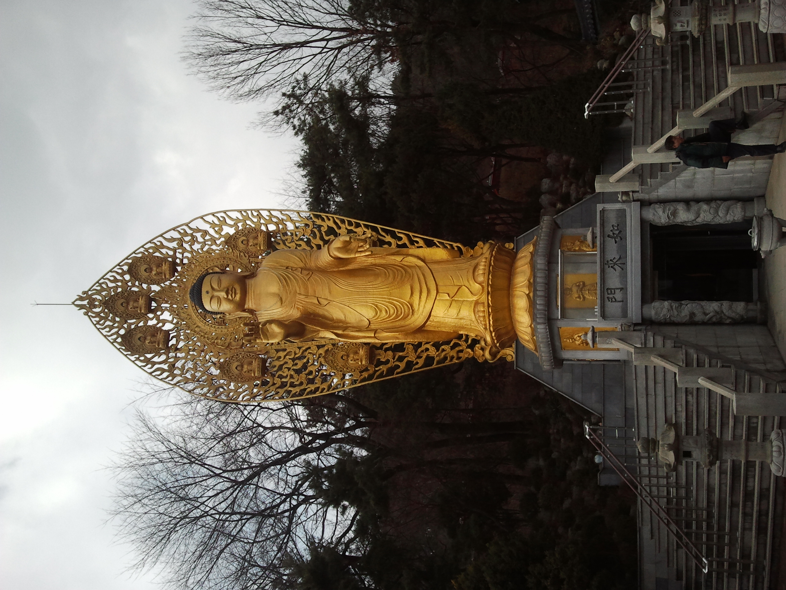 Monumental golden Buddha statue