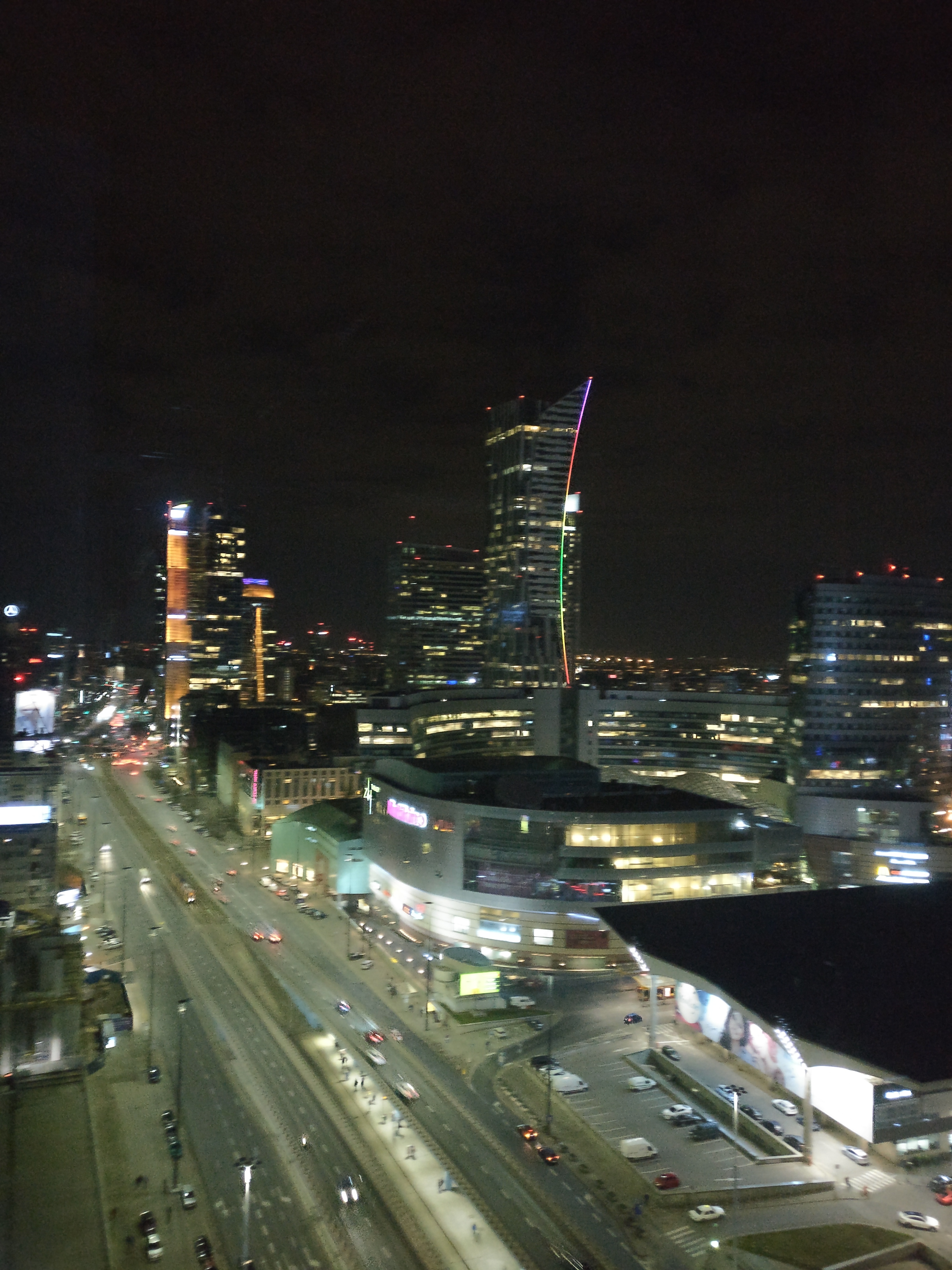 Full cityscape showing traffic patterns and building lights